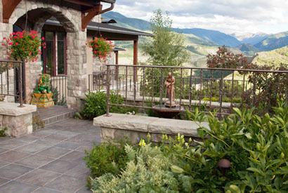 Self-watering potted plants and solar-powered water feature sculpture